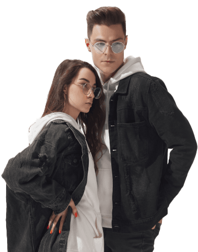 A man and a woman wearing denim jackets over white hoodies